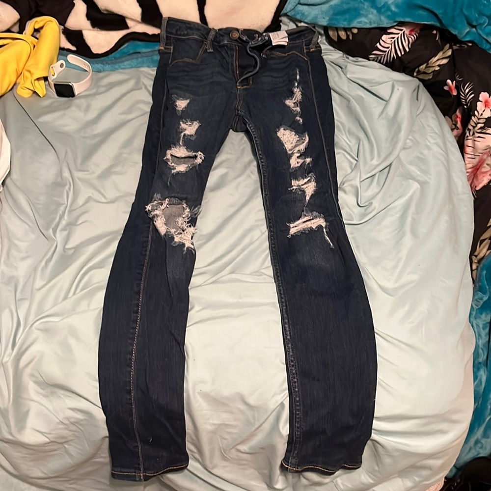 Holdover jeans with holes